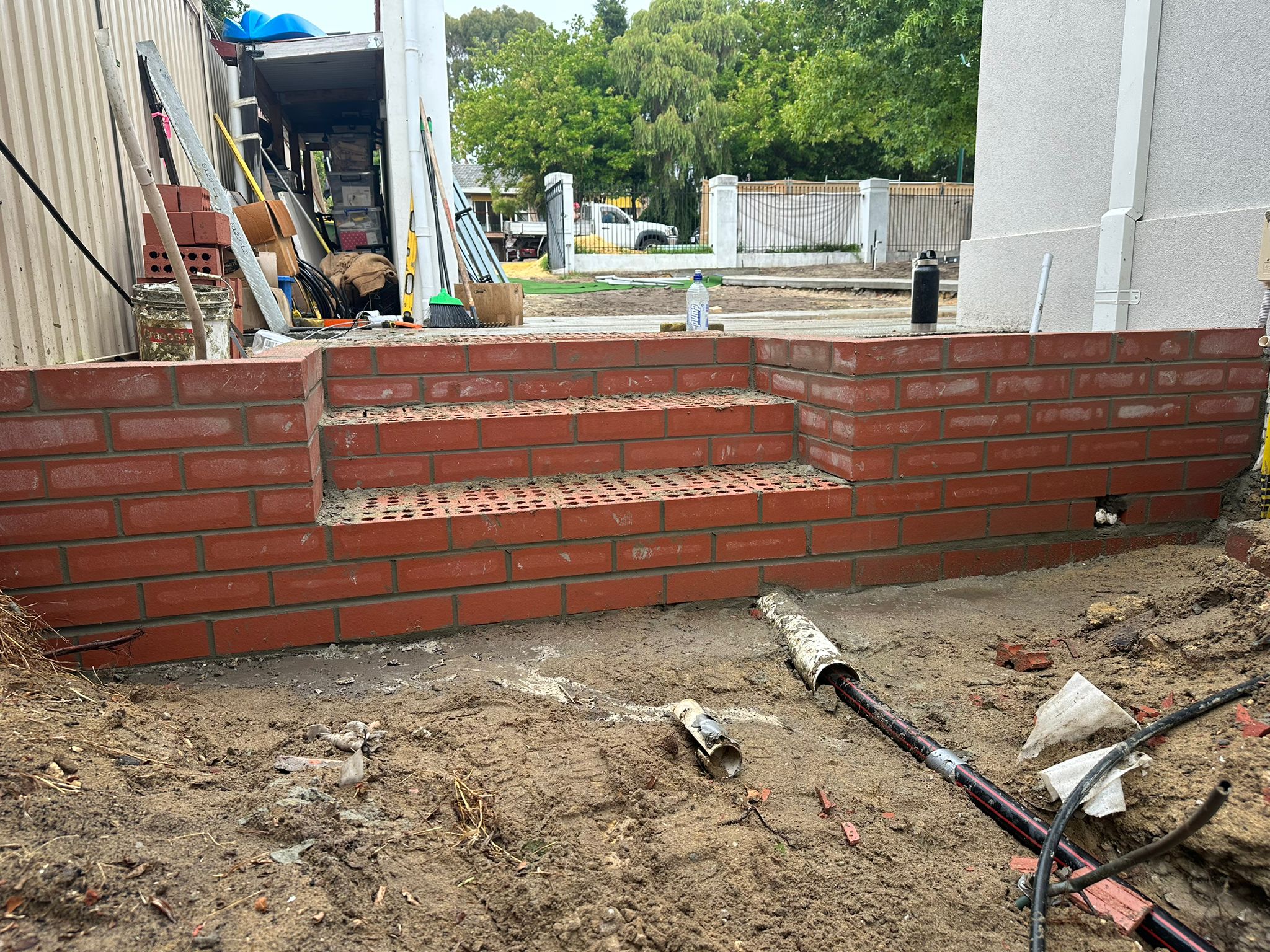 Side view of the completed retaining brick stairs and wall — Nedlands